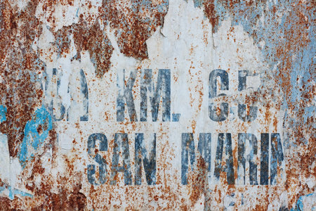 Old rusty wall with letters