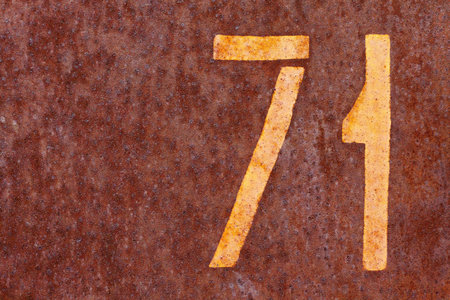 number seventy one on a rusty background