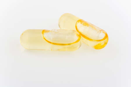 Close up of capsules Omega 3 on light background. Health care conceptの写真素材