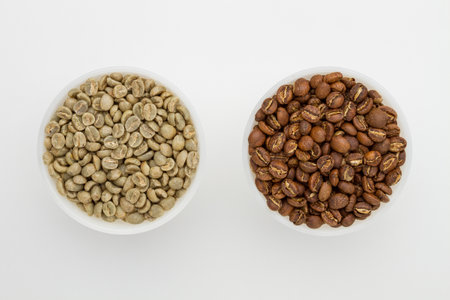 Specialty green and roasted coffee beans from Kenya on a white background. top viewの写真素材
