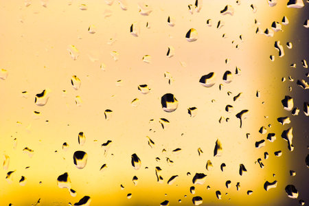 Abstract orange water drops textured framed backgroundの写真素材