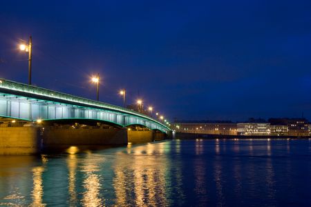 Night Bridge across Neva river in St.Petersburg, Russiaの写真素材