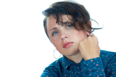 Headshot of tired upset woman isolated on whiteの写真素材