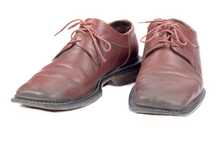 Pair used brown mans shoes isolated on white