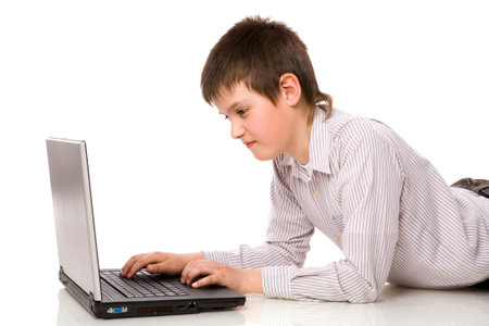 Ten years Boy Surfing the net isolated on white