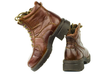 Military brown man's shoes with zipper and laces isolated on white
