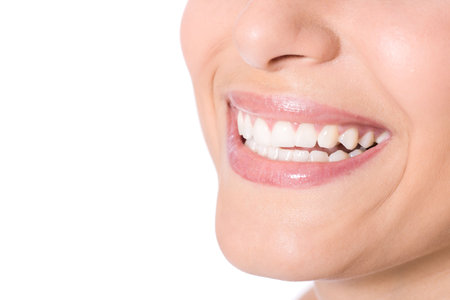 Happy cheerful girl's smile with white teeth isolated on white