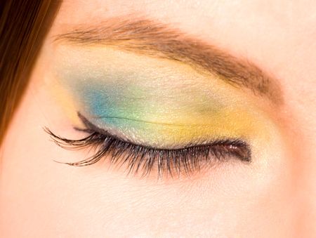 Macro shot of closed female eye with clorful make upの写真素材