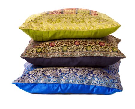 Three soft pillows lying one above another isolated on whiteの写真素材