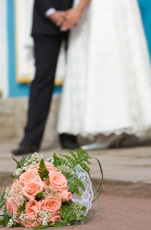 Bride's bouquet new married couple holding handsの写真素材
