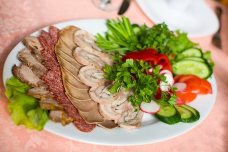 Meat and bloated sausage Slices on plate macro shotの写真素材