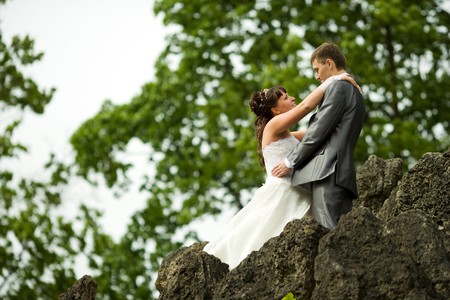 Bride and groom posing summer park outdoorsの写真素材