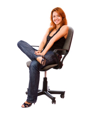 Cheerul Secretary sitting on office chair isolated on whiteの写真素材