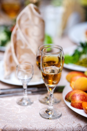 Wine and fruits on restaurant table before party beginsの写真素材