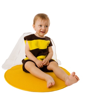Toddler boy wearing bee costume isolated on whiteの写真素材