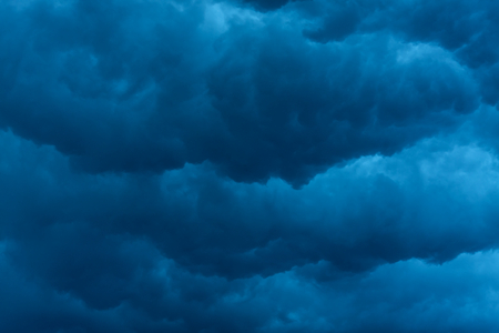 heavy massive stormy clouds with no sunlightの写真素材