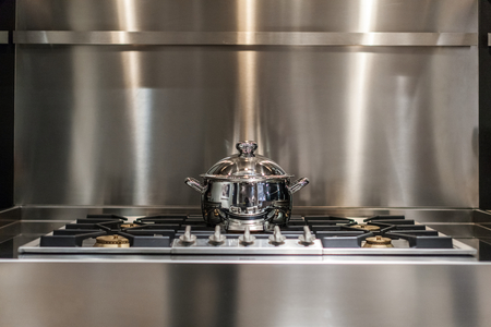new stainless steel saucepan on modern kitchen rangeの写真素材
