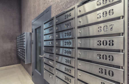 Empty hall luxury interior with mailboxes on wall closeupの写真素材