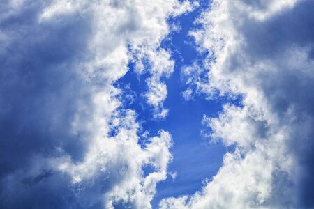 Bright deep blue sky beautiful clouds and fresh air for backgroundの写真素材