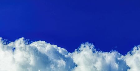 Bright deep blue sky beautiful clouds and fresh air for backgroundの写真素材
