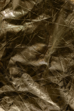 background metal glitter texture crumpled gold shine cracked trendy luxury foil discoの写真素材