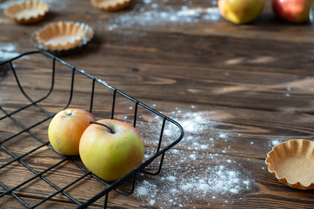 background brown tree apples dough baking dish dessert flour home basket whisk red yellowの写真素材