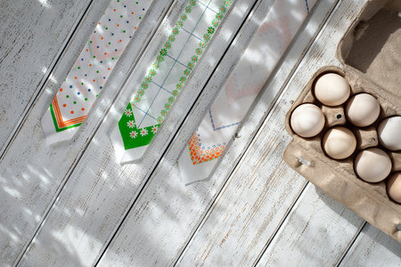 box of eggs on a white table. Easter decoration. colored wrap