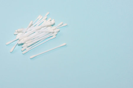 Ear sticks on a blue background. Hygiene, cosmetic.