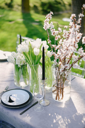 Table setting at a luxury wedding and Beautiful flowers on the table. black and white