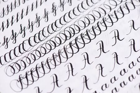 Black ink calligraphy on lined sheet of paper. Learning calligraphy art. Calligraphy recipes .Samples in words.の写真素材