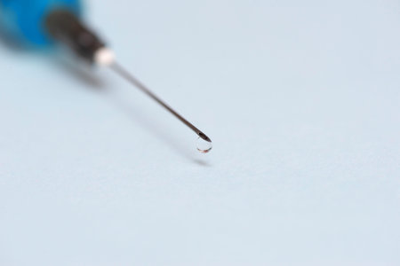medical syringe on a blue background. empty place. Medicine.