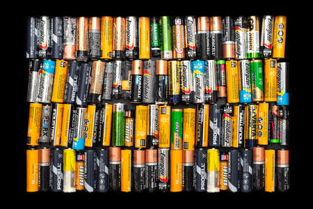 Used alkaline batteries AA size format of different brands ready for recyclingのeditorial素材