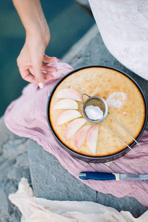 A peach pie placed on the stonesの写真素材