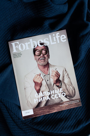 wedding rings lie on Forbes Life magazine. funny joke concept.