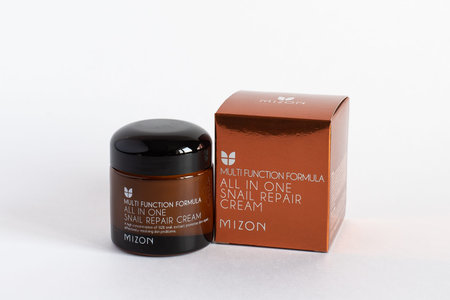 Russia, Rostov-on-Don, 05.07.2018 Korean cosmetics, Mizon multi function formula snail repair perfect cream, isolated on white background.のeditorial素材