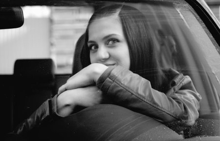 Attractive young woman in automobile