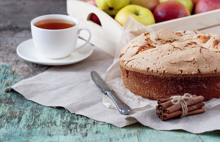 Apple pie with a cup of tea on a wooden background. Apple pie Apples Cup of tea Piece of cake Wooden background Delicious dessertの写真素材