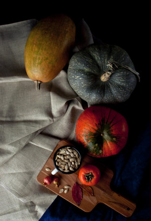 Autumn arrangement: persimmon, pumpkin, feijoa with autumn leaves. Autumn fudfoto lifestyleの写真素材