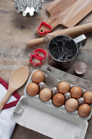 Kitchen items Metal Utensils Spoon Eggs on a wooden table. Cooking Baking Eggs Groceries Top View...