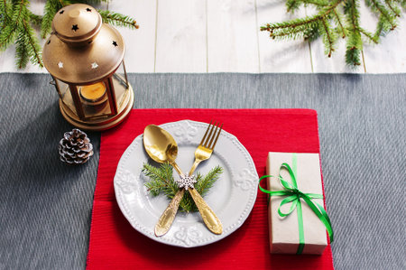 Christmas serving table. Traditional festive decoration background top view. Cutlery utensils...