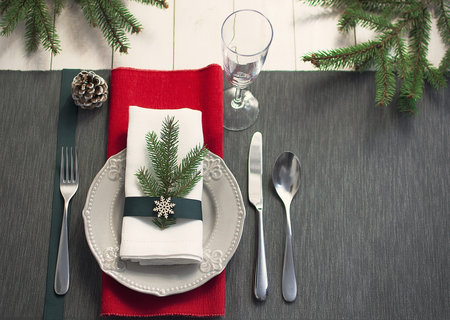 Christmas serving table. Traditional festive decoration background top view. Cutlery utensils...