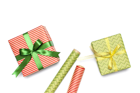 Gift boxes, packing paper, scissors, ribbon on white background. Festive background, congratulation, gift wrapping, Christmas and new year theme. Flat lay top view copy space.の写真素材