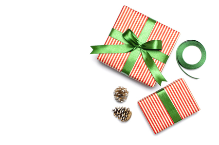 Gift boxes, packing paper, scissors, ribbon on white background. Festive background, congratulation, gift wrapping, Christmas and new year theme. Flat lay top view copy space.の写真素材