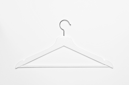 White wooden hanger isolated on white background top view. Store concept, sale, design, empty hanger Place for text.の写真素材