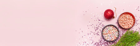 Cosmetic makeup blush, powder, christmas balls, holographic glitter confetti in the form of stars on...