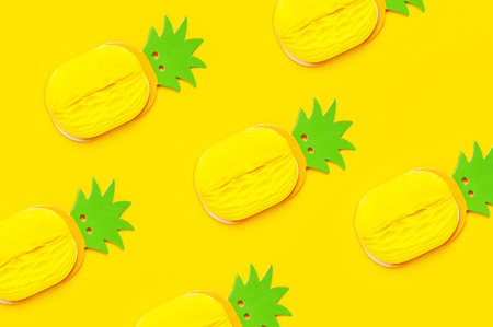 Creative summer pattern bright sweet tropical pineapple of paper on yellow background Flat lay top view copy space. Minimalistic food concept, origami paper fruit. Pineapple background.の写真素材