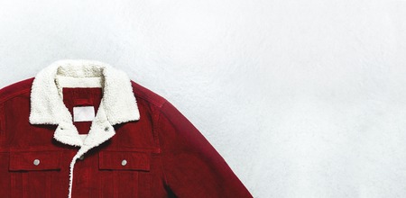 Red corduroy men's jacket on gray background top view flat lay copy space. Male fashion, winter autumn spring jacket, youth hipster clothes, stylish thing, denim trendy jacket, store sale concept.の写真素材