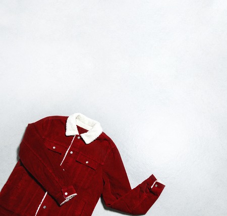 Red corduroy men's jacket on gray background top view flat lay copy space. Male fashion, winter autumn spring jacket, youth hipster clothes, stylish thing, denim trendy jacket, store sale concept.の写真素材