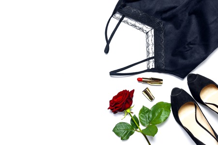 Female black T-shirt jacket with lace, classic shoes, red lipstick and rose flowers on white background top view flat lay. Beauty fashion background. Sexy clothes, fashion look, women's holidayの写真素材