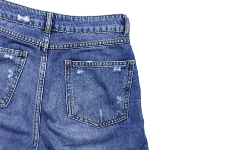 Blue jeans isolated on white background top view flat lay. Detail of nice blue jeans. Jeans texture or denim background. Trend clothing. Beauty and fashion, clothing conceptの写真素材